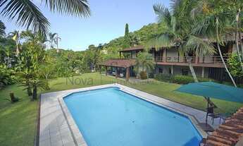 Imagem 4: Casa com vista Cristo e Lagoa em localização arborizada