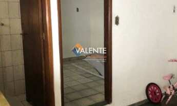 Imagem 6: Casa com 4 dormitórios e churrasqueira no bairro Vila Tupi na Praia Grande