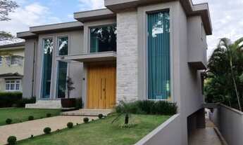 Imagem 4: Casa de condomínio para aluguel e venda possui 729 metros quadrados com 5 quartos