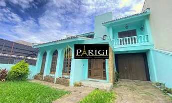 Imagem 2: Casa com 4 dormitórios para alugar, 325 m² por R$ 5.000,00/mês - Navegantes - Porto Alegre