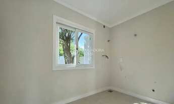 Imagem 7: CASA TÉRREA NO CENTRO DE XANGRI-LÁ, FRENTE LESTE, DIVISA COM ATLÂNTIDA