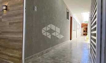 Imagem 2: Casa geminada a venda na praia grande, bairro maracanã, com 2 quartos e 2 vagas