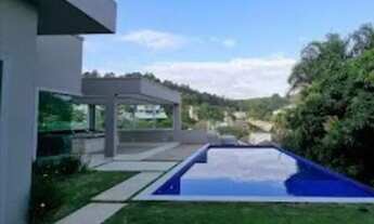 Imagem 7: Casa de condomínio para aluguel e venda possui 729 metros quadrados com 5 quartos