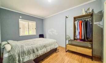 Imagem 7: Casa Térrea 3 Dormitórios 1 suíte, churrasqueira, amplo pátio, 3 vagas garagem, próxima ao