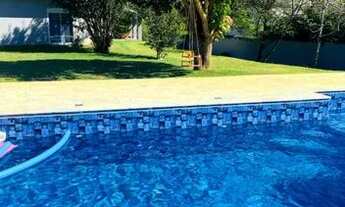 Imagem 5: Se você procura uma casa totalmente térrea com 3 suítes e terreno de 1.760m e num condomín