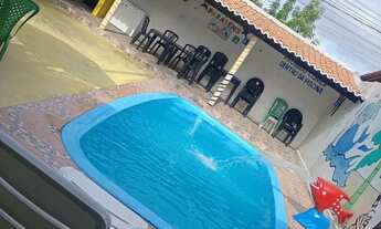 Imagem 2: Área de lazer com piscina e casa