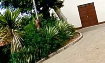 Imagem 6: Vende-se esse terreno com 8 tarefas com escritura passando o calçamento em frente