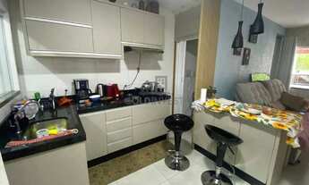 Imagem 3: Exclusiva Casa Geminada no Aimoré: Deck de Madeira Rústica com Vista para a Floresta e Rio