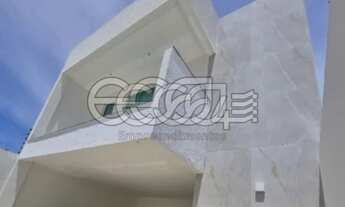 Imagem: Casa as margens do Rio Sergipe com o Mar