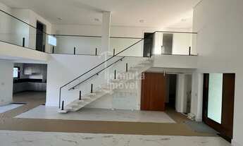 Imagem 5: Casa à venda com 340 m², 4 suítes, sala de estar, cozinha, hidromassagem e 2 vagas garagem