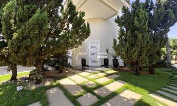 Imagem 2: Belíssimo sobrado à venda com 4 suítes sendo 1 suíte máster e térrea, área Gourmet e pisci