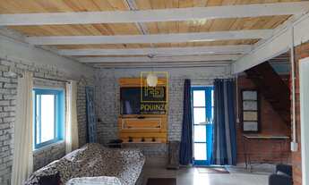 Imagem 3: Casa de tijolinho à vista cercada pela natureza em Rio dos Cedros