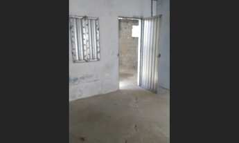 Imagem 3: Terreno com construção precisando de reforma