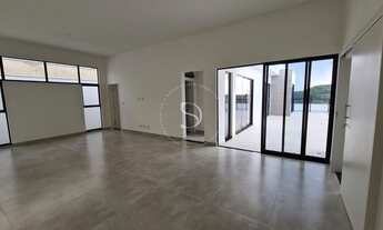 Imagem 4: Com design moderno e materiais atemporais, essa casa é praticamente linear já que a parte