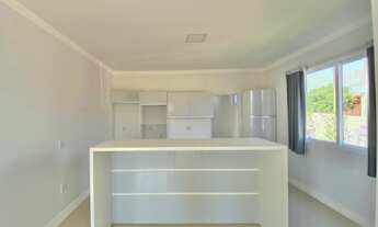 Imagem 5: Casa com três dormitórios e área gourmet em Torres