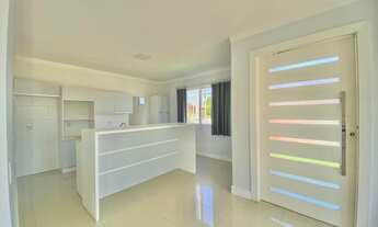 Imagem 4: Casa com três dormitórios e área gourmet em Torres