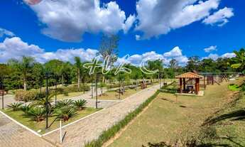 Imagem 7: Terreno à Venda no condomínio Terras de Genova - lote em declive com uma vista p