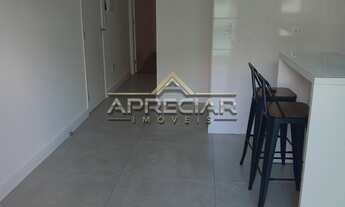 Imagem 7: Apartamento com dois dormitórios, sala com varanda gourmet, cozinha planejada com cooktop