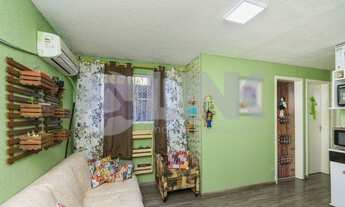 Imagem 2: Apartamento de 2 dormitórios à venda com 1 vaga de garagem em Porto Alegre, no bairro Glór