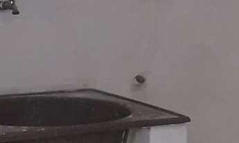 Imagem 2: Residência Confortável e Prática: Garagem Coberta, Três Dormitórios Aconchegantes, Sala A