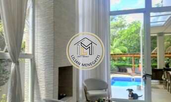 Imagem 2: Casa em condomínio com 3 quartos, 3 suítes. Piscina privativa. Área gourmet. Churrasqueira