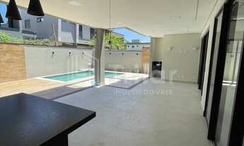 Imagem 2: Lindíssimo sobrado em condomínio fechado com 4 suítes e lazer com piscina com previsão de