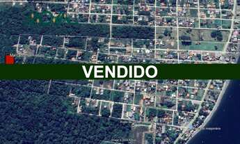 Imagem: Terreno de Esquina com Vegetação, rua