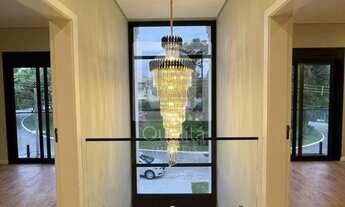 Imagem 2: Casa nova à vendo no Alphaville com piscina de borda infinita e área gourmet