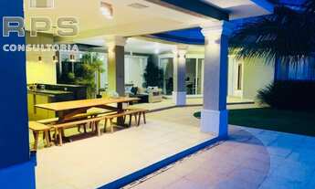 Imagem 6: Casa totalmente térrea no condomínio flamboyant, com 5 suítes, repleta de salas, área de