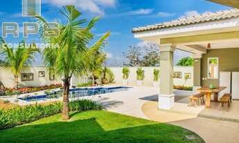 Imagem 2: Casa totalmente térrea no condomínio flamboyant, com 5 suítes, repleta de salas, área de