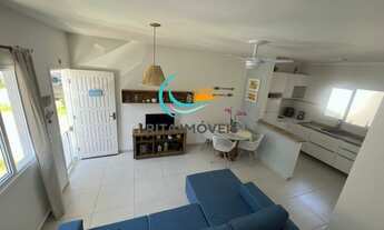 Imagem 2: Localizada em um bairro tranquilo e familiar, essa casa de 2 suítes é perfeita para quem b