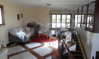 Imagem 5: Imóvel com 22 anos com projeto moderno em revestimento de madeira nobre ( Ipê , Mogno ) Ru