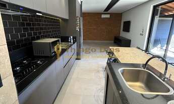 Imagem 4: Casa moderna com cozinha gourmet com churrasqueira, piscina e ampla varanda á venda no bai