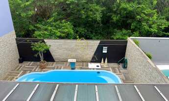 Imagem 2: CASA 3 QUARTOS, MODERNA, COM PISCINA E ÁREA DE CHURRASCO PARA UMA ESTADIA PERFEITA