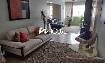 Imagem: Apartamento com três quartos sendo uma