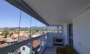 Imagem 4: Prédio frente ao mar no centro de Bertioga com 2 dormitórios, 1 suíte, 2 vagas de garagem