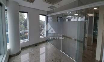 Imagem 3: Sala com piso de granito e divisórias de vidro, à venda no Edifício Monte Carlo, na Alamed