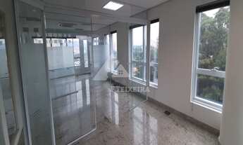 Imagem 4: Sala com piso de granito e divisórias de vidro, à venda no Edifício Monte Carlo, na Alamed