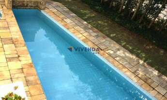 Imagem 2: Sobrado com 5 suítes, todas com closet, amplo living com lareira, piscina, espaço gourmet