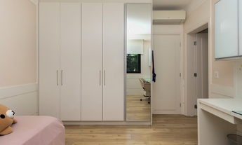 Imagem 4: Com 4 quartos espaçosos, sendo 2 suítes, este imóvel é perfeito para acomodar toda a sua f