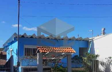 Imagem: A casa possui 2 Dormitórios, 1 Banheiro, 1 Vaga na garagem