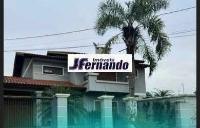 Imagem: A casa possui 3 Dormitórios, 2 Suítes, 5 Banheiros, 3 Vagas