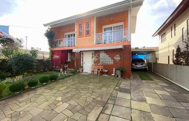 Imagem: A casa possui 3 Dormitórios, 1 Suíte, 3 Banheiros, 1 Vaga