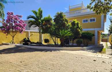 Imagem: A casa possui 5 Dormitórios, 4 Suítes, 5 Banheiros, 4 Vagas
