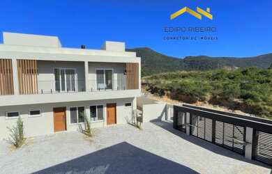 Imagem: A casa possui 2 Dormitórios, 1 Suíte, 1 Banheiro, 1 Vaga na