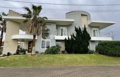 Imagem: A casa em condomínio possui 5 Dormitórios, 5 Suítes, 1 Banheiro