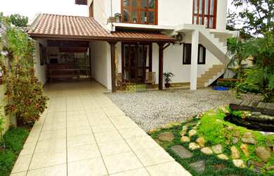 Imagem: A casa possui 2 Dormitórios, 1 Banheiro, 3 Vagas na garagem