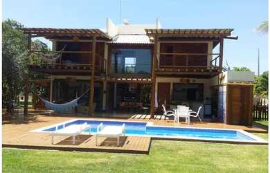 Imagem: A casa em condomínio possui 4 Dormitórios, 4 Suítes, 7 Banheiros