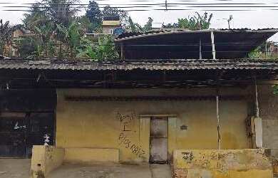 Imagem: A casa possui 2 Dormitórios, 1 Banheiro, 2 Vagas na garagem