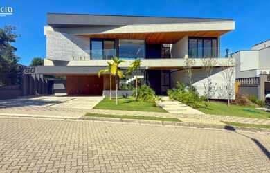 Imagem: A casa em condomínio possui 5 Dormitórios, 5 Suítes, 6 Banheiros